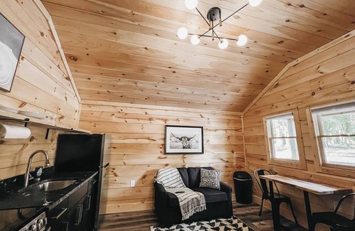 Hartwell RV Rental | Cabin #3: One king-size bed, a full kitchen, and a large gravel parking pad beside the cabin for easy boat or trailer storage.