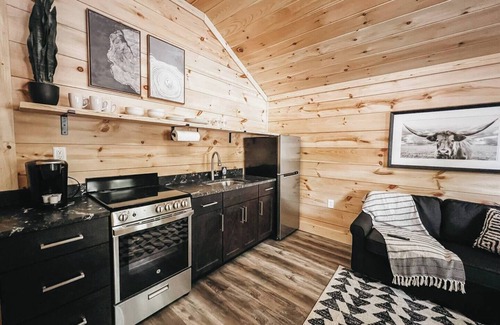 Hartwell RV Rental | Cabin #3: One king-size bed, a full kitchen, and a large gravel parking pad beside the cabin for easy boat or trailer storage.