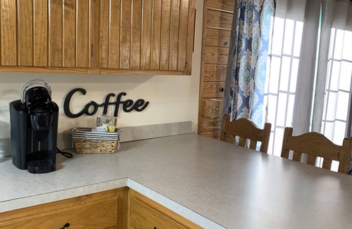 Heavener Cabin | Cabin at Runestone Hideaway just steps from Heavener Runestone Park.