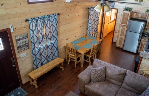 Gepp Cabin | Cabin featuring a vaulted ceiling, a large porch, and huge patio with fire pit.