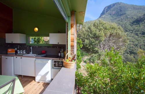 Olmeta di Capocorso Cabin | Cabin in the maquis, terrace and open kitchen with sea and mountain views