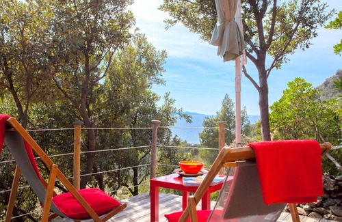 Olmeta di Capocorso Cabin | Cabin in the maquis, terrace and open kitchen with sea and mountain views