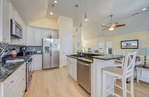 Captain's Cove House | Calypso is a breathtaking Waterfront Vacation Home in Captain`s Cove.