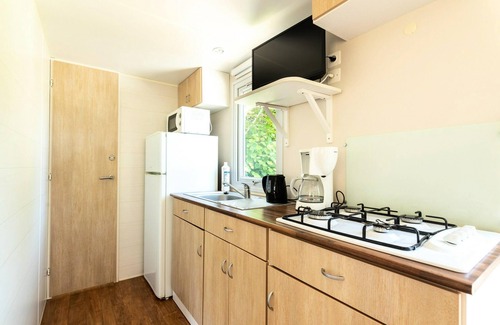 Canet-de-Salars House | Camping Le Caussanel* - Cottage Loggia Confort 3 rooms 4 people Air-conditioned