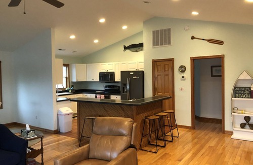 Colington Harbour House | Canal Front Home with Private Dock, Multiple Decks & Hot Tub