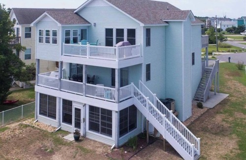 Colington Harbour House | Canal Front Home with Private Dock, Multiple Decks & Hot Tub