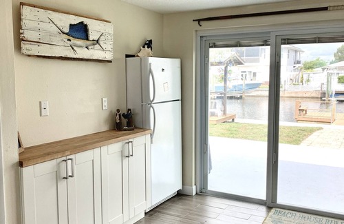 Hudson Beach Estates House | Canal front home walking distance to restaurants and small beach