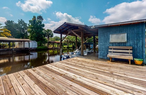 Astor House | Canal-Front Home with Private Covered Boat Dock & Waterfront Screened Porch