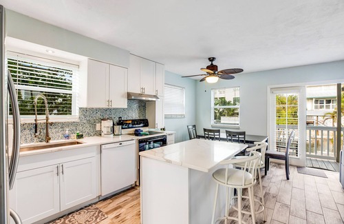 Big Coppitt Key House | Canalside condo with private dock, boat ramp, water-view patio, central AC & W/D