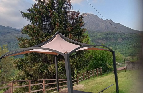 Bene Lario RV Rental | Caravan "Glamping C Selva Tenda Quercia" with Mountain View & Shared Garden