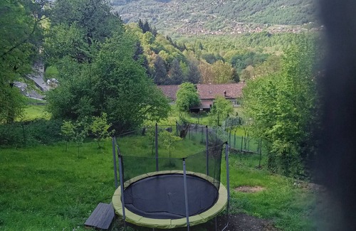 Bene Lario RV Rental | Caravan "Glamping C Selva Tenda Quercia" with Mountain View & Shared Garden