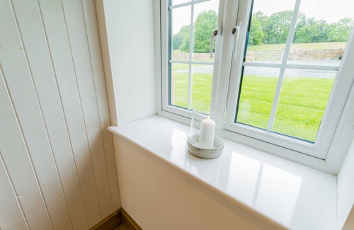 Bodorgan Cottage | Carrog Barn - a ground floor bedroom that sleeps 6 guests in 3 bedrooms