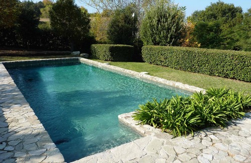 Santa Vittoria in Matenano Villa | Casale Oliva in a landscape of oaks, olives and cherry trees.