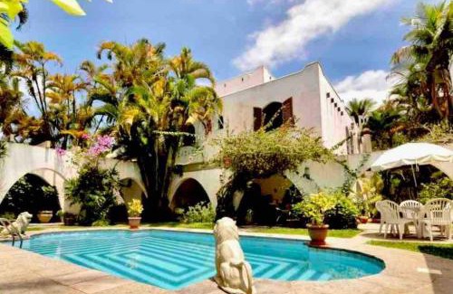 Jardim Virginia House | Casa aconchegante,perto da praia,com piscina,muito jardim,e pet friendly