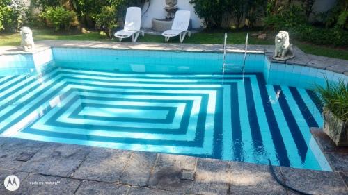 Jardim Virginia House | Casa aconchegante,perto da praia,com piscina,muito jardim,e pet friendly