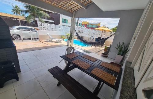 Mosqueiro House | Casa cinza em frente à praia em condominio