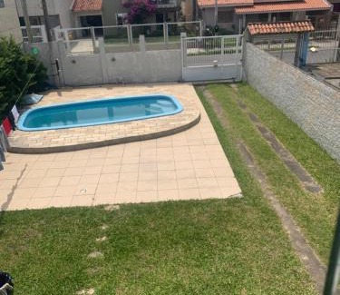 Tramandai House | Casa com 4 quartos e piscina pra aproveitar