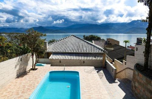 Caiacanga House | Casa com piscina vista mar por do sol