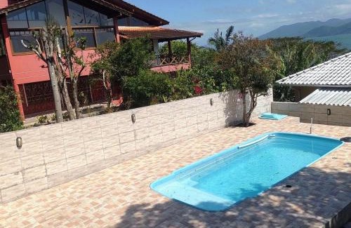 Caiacanga House | Casa com piscina vista mar por do sol