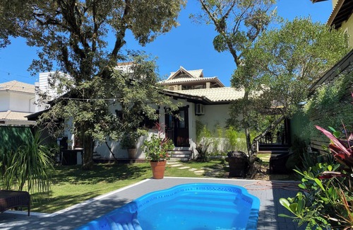 Porto da Lagoa House | Casa de Praia com Trilha Privativa em Condomínio Fechado