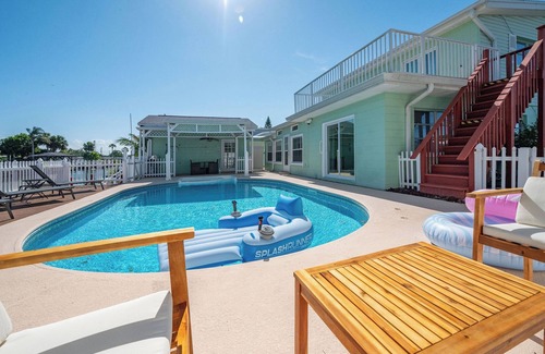 Hampton Homes House | Casa Las Olas - Waterfront Home with Heated Pool, Movie Theater & Arcade