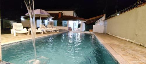 Jardim Neptunia House | Casa piscina pé na areia Bertioga