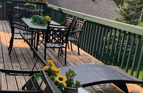 Sunbreaker Cove Cottage | Cedar Log Cottage , nestled in the trees with wrap around deck