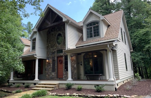 Henderson House | Celebrate Spring! Beautiful, custom Kerr Lake lodge home + private dock.