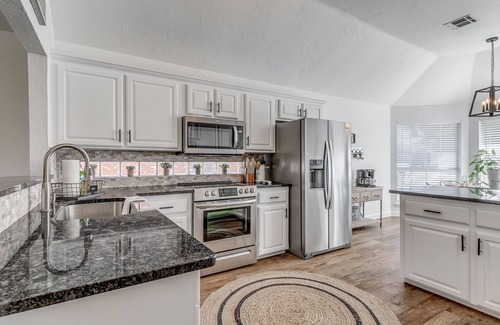 Edmond House | Central Edmond ~Boho, modern style with loft & fire pit in large backyard~
