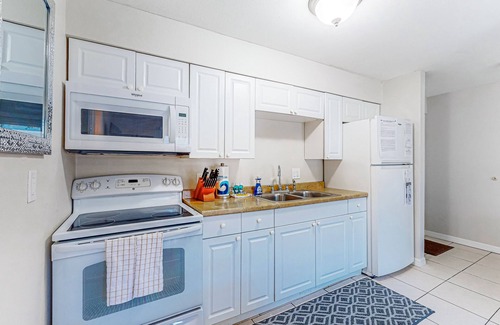 Largo Condo | Centrally located condo with heated pool, balcony, washer/dryer & central AC