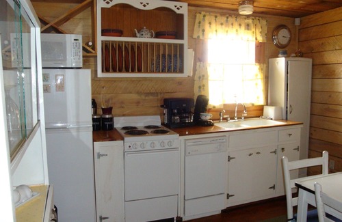 Pittsboro House | Century old log cabin on 62 acre estate