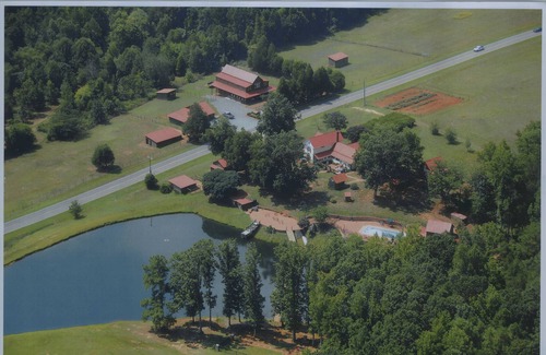 Pittsboro House | Century old log cabin on 62 acre estate