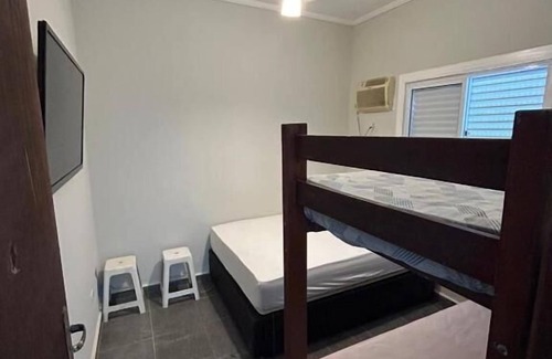 Enseada Ski Chalet | Chale com ar na praia da Enseada