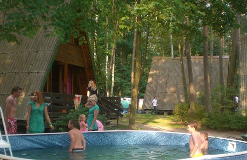 Sierakow Ski Chalet | Chalet on a holiday park in a wooded area by the lake and near a beach.