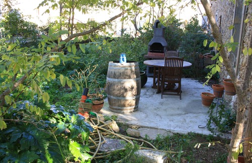Ornaisons Cottage | Character building on large wooded grounds with private garden.