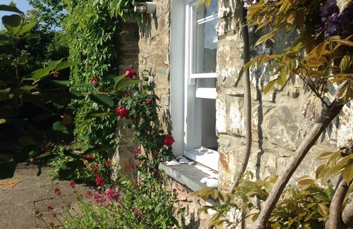 St Dogmaels Cottage | Character cottage in heart of village with stunning estuary view and garden