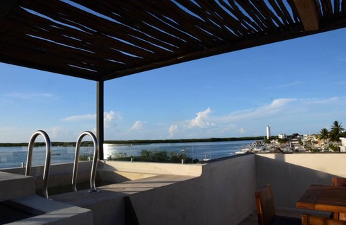 Rio Lagartos Apartment | Charming 1-Bedroom Apartment in Río Lagartos. AC, Rooftop Deck & Private Pier -F