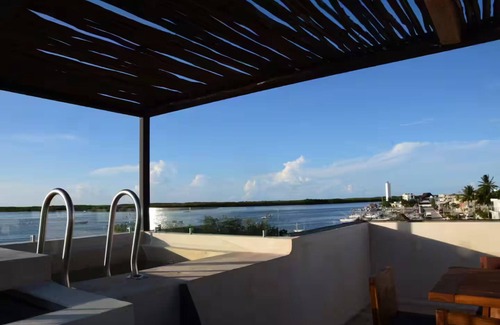 Rio Lagartos Apartment | Charming 1-Bedroom Apartment in Río Lagartos. AC, Rooftop Deck & Private Pier -Y