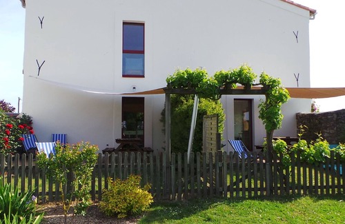 Chateau-Thebaud Cottage | Charming 15th-Century Cottage in Vineyard with Terrace, Bikes & EV Charging