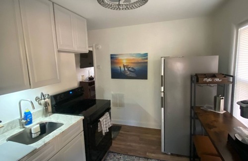 Charlotte House | Charming 2-bedroom home filled with lovely natural light on a quiet street