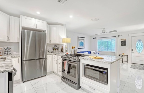Florida North Atlantic Coast House | Charming 3BR Canal Home w/patio dining, Fire Pit & Workspace