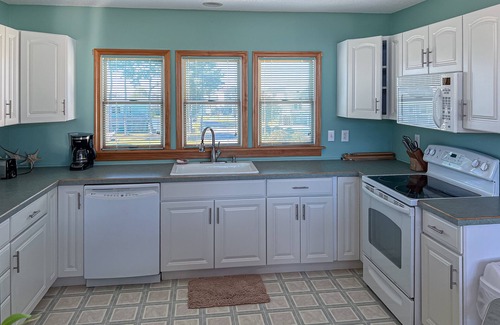 Colington Harbour House | Charming 4BR waterfront home with Private Hot Tub, Full kitchen, and WIFI