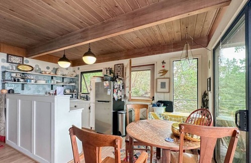 Three Tree Point House | Charming and eclectic treehouse-like home with expansive Puget Sound views