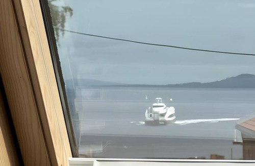 Royken Apartment | Charming attic apartment by the sea - with fireplace and cozy living room