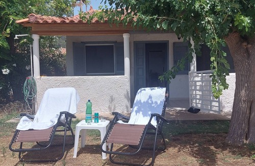 Katakolo House | Charming beachfront 2-bedroom house with AC and WiFi.