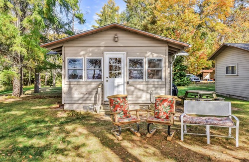 Three Lakes House | Charming, dog-friendly, lakefront cottage with boat dock, grill, & firepit