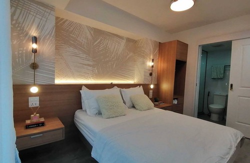 Don Bosco Resort | Charming family-sized condo at Azure Urban Resort with a grand wave pool!
