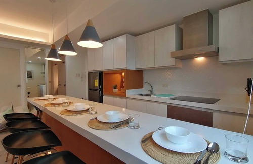 Don Bosco Resort | Charming family-sized condo at Azure Urban Resort with a grand wave pool!