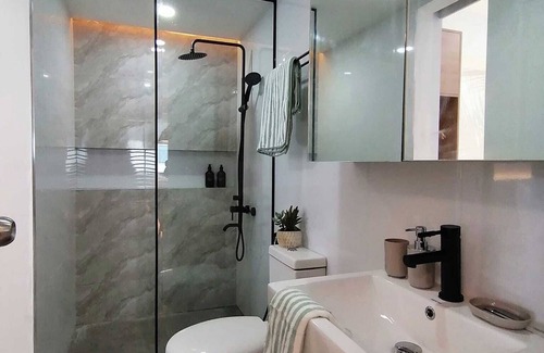 Don Bosco Resort | Charming family-sized condo at Azure Urban Resort with a grand wave pool!