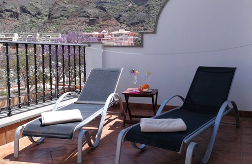 Playa de Mogan Condo | Charming, modern apartment with terrace, directly on the sea, free WiFi
